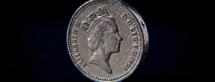 British pound coin on a black background