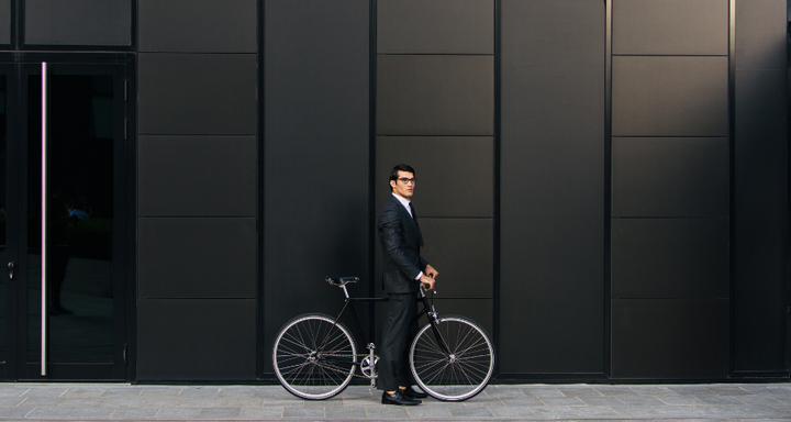 Businessman cycling in London 