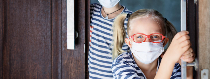 Children wearing surgical masks