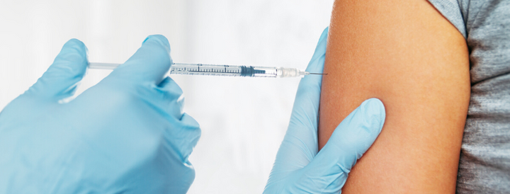 Doctor applying a vaccine on a patient