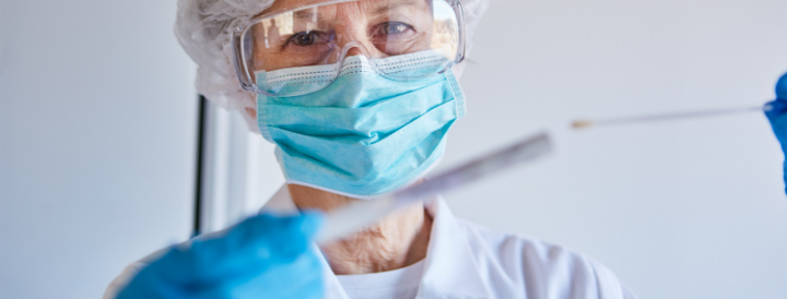 Doctor holding a covid-19 swab 