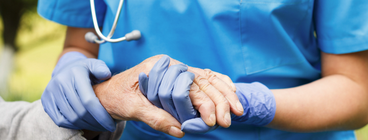 Doctor holding a patient's hand 