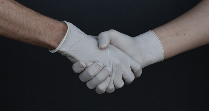Doctors Shaking Hands in Latex Gloves