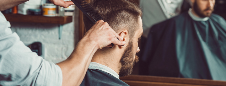 Man getting a haircut in a barbershop