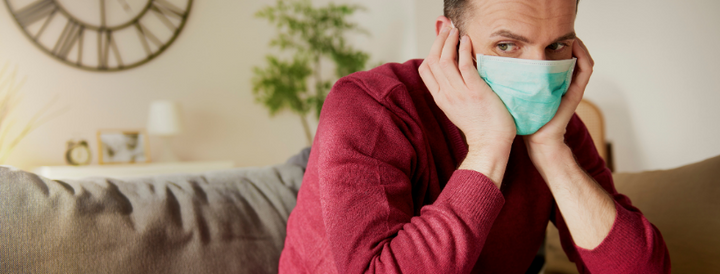 Man wearing a mask indoors