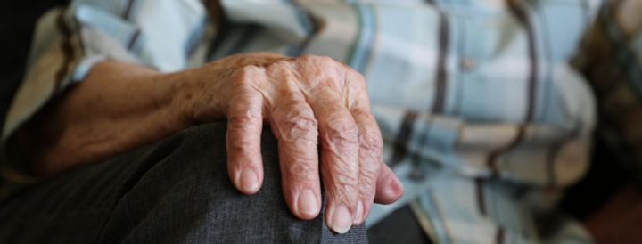 Close up picture of an old man's hand