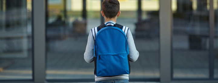 Kid Wearing a backpack at school 