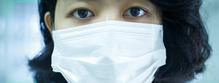 Woman wearing a surgical mask 